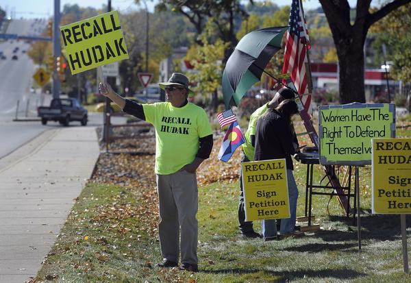 Groups opposed to and in support of the recall of Sen. Evie Hudak from District 19 gather to wave signs along Wadsworth Blvd.