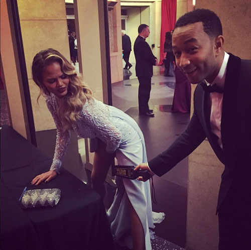 Here Chrissy Teigen and John Legend horse around at one of the security screening stations. Yes, even the celebs had to go through security.