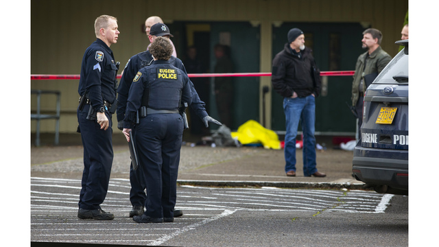 Eugene police secure the scene in front of Cascade Middle School in Eugene, Ore., Friday Jan. 11, 2019, after an officer involved shooting. (Chris Pietsch/The Register-Guard via AP)