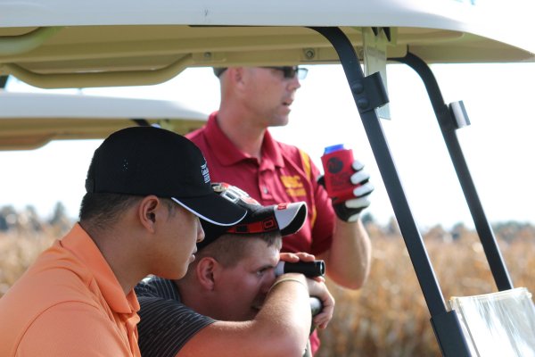 From close to far, "Norm", Billy and Brett look over their options before playing their next shot.